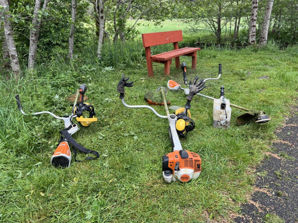 Three strimmers resting
